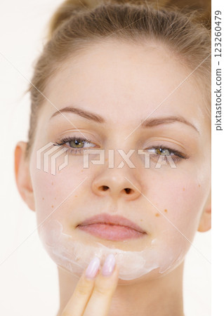 Girl apply facial cream cosmetic Girl apply facial cream cosmetic 123260479