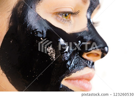 Woman with black peel off mask on face 123260530