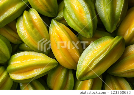 Close-up of fresh star fruit with vibrant green and yellow skin 123260683
