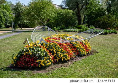 Flowerbed in the form of a beetle in the park. 123261413
