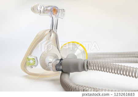 Respiratory mask for sleep disorders isolated over white. Apnea. Air pump. Assisted breathing. 123261683