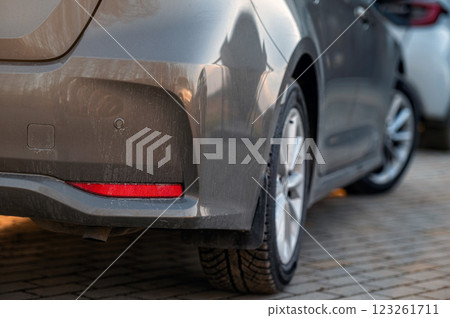 Close-up of the rear part of a car parked in the street. Selective focus Close-up of the rear part of a car parked in the street. Selective focus 123261711
