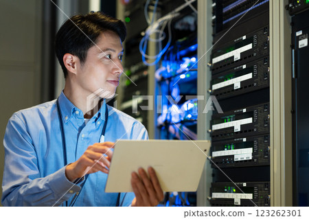 A middle-level engineer managing a server. Filming cooperation: SKY Perfect Tokyo Media Center A middle-level engineer managing a server. Filming cooperation: SKY Perfect Tokyo Media Center 123262301