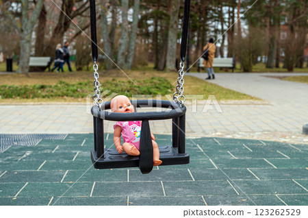 Doll Swinging in Park 123262529