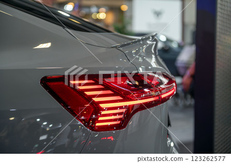 Rear red stop signal lamp on a modern car. Close-up. Selective focus. 123262577