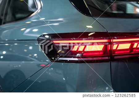 Rear red stop signal lamp on a modern car. Close-up. Selective focus. 123262585