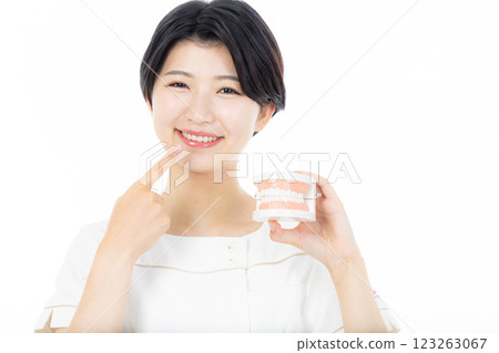 Dental hygienist with toothbrush Dental hygienist with toothbrush 123263067