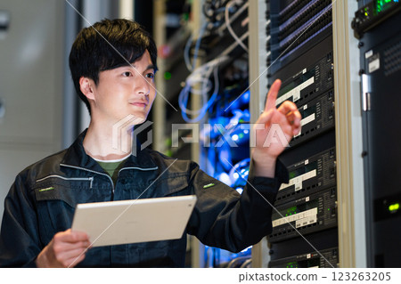 Engineers working in a server room. Photo courtesy of Sky Perfect Tokyo Media Center. Engineers working in a server room. Photo courtesy of Sky Perfect Tokyo Media Center. 123263205