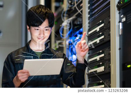 Engineers working in a server room. Photo courtesy of Sky Perfect Tokyo Media Center. Engineers working in a server room. Photo courtesy of Sky Perfect Tokyo Media Center. 123263206