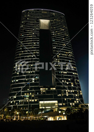 Skyscraper with lights in the windows late at night Skyscraper with lights in the windows late at night 123264059