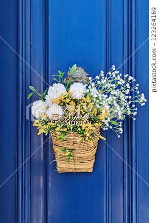 Soft blossoms elegantly spill from woven basket, arrangement capturing Easter spirit, arrangement blending pastel hues with subtle whimsy, arrangement perfect for springtime celebrations Soft blossoms elegantly spill from woven basket, arrangement capturing Easter spirit, arrangement blending pastel hues with subtle whimsy, arrangement perfect for springtime celebrations 123264169