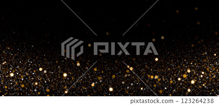 Shiny golden glitter particles on black backdrop with sparkling lights, glowing dust effect, elegant decoration, luxury overlay, vibrant design, magical bokeh, glowing festive background. 123264238