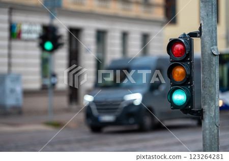 traffic light on the street junction with beautiful bokeh, city with cars in the background 123264281