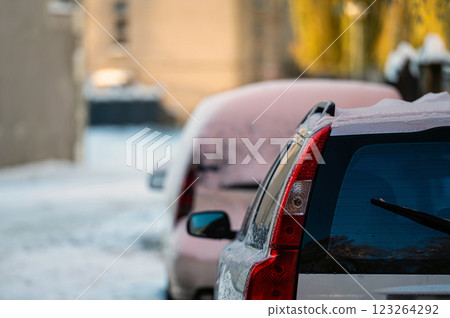 Snow-covered cars in the yard. 123264292