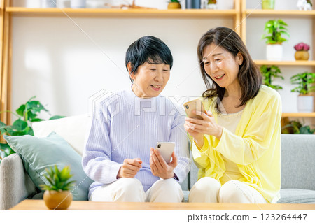 Two senior women looking at a smartphone 123264447