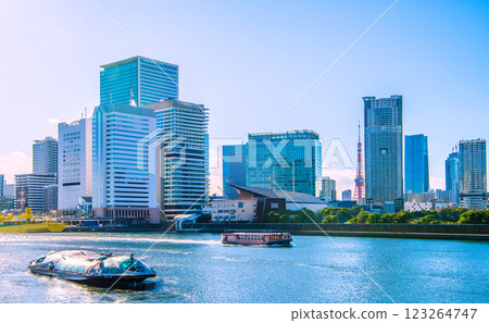 New scenery of Tokyo cityscape in Japan. Water buses Himiko, Ryoma, Tachibanamaru, Takeshiba, Hamamatsucho... Tokyo Tower and Azabudai in the background. 123264747
