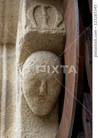 Stone head on the portal, Kajov, Czechia Stone head on the portal, Kajov, Czechia 123265345