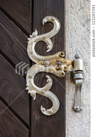 Detail of forging on the church door, Kajov, Czechia 123265391