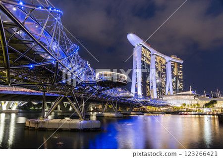 Building view of The Helix Bridge and the Marina Bay Sands Resort, Singapore, it's a pedestrian bridge linking the Marina Centre with Marina South. Building view of The Helix Bridge and the Marina Bay Sands Resort, Singapore, it's a pedestrian bridge linking the Marina Centre with Marina South. 123266421