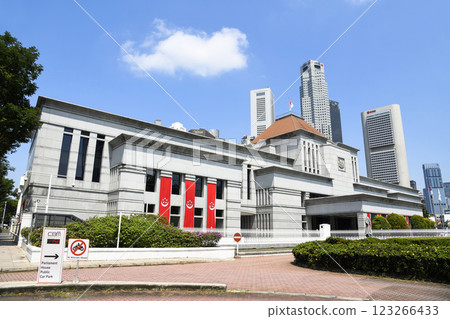 View of the Singapore Parliament House, a public building and a cultural landmark on the bank of the Singapore River, with a background of Financial District skyscrapers. View of the Singapore Parliament House, a public building and a cultural landmark on the bank of the Singapore River, with a background of Financial District skyscrapers. 123266433