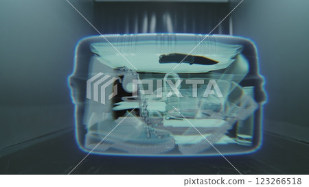 VFX Animation Visualizing Inside the Suitcase Illuminated by X-ray Metal Detector Scanning 123266518