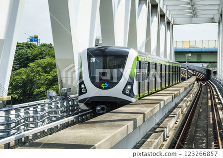 A Green Line train running on the elevated track of the Taichung Rapid Transit System in Taiwan.  123266857