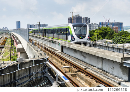 A Green Line train running on the elevated track of the Taichung Rapid Transit System in Taiwan.  123266858