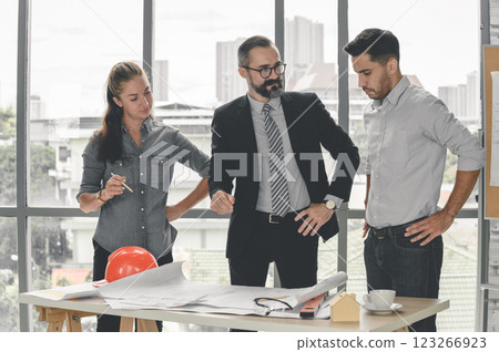 Construction engineer and architect check plan working with the blueprint on office worker conference site. Engineers team meeting for architectural project. Construction Concept. 123266923