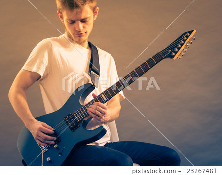 Man playing on electric guitar Man playing on electric guitar 123267481