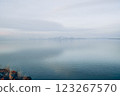 Beautiful sunset over the lake. Sunrise on the sea. Beautiful landscape with lake, mountains and sunset. Reflection in the water	 123267570