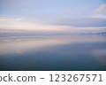 Beautiful sunset over the lake. Sunrise on the sea. Beautiful landscape with lake, mountains and sunset. Reflection in the water	 123267571