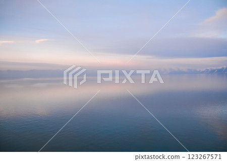 Beautiful sunset over the lake. Sunrise on the sea. Beautiful landscape with lake, mountains and sunset. Reflection in the water Beautiful sunset over the lake. Sunrise on the sea. Beautiful landscape with lake, mountains and sunset. Reflection in the water 123267571