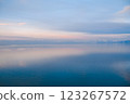 Beautiful sunset over the lake. Sunrise on the sea. Beautiful landscape with lake, mountains and sunset. Reflection in the water	 123267572