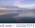 Beautiful sunset over the lake. Sunrise on the sea. Beautiful landscape with lake, mountains and sunset. Reflection in the water	 123267573