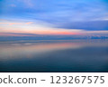 Beautiful sunset over the lake. Sunrise on the sea. Beautiful landscape with lake, mountains and sunset. Reflection in the water	 123267575