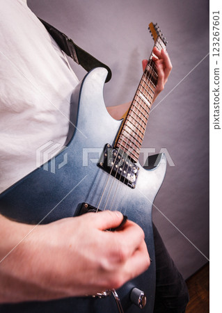 Close up of man playing on electric guitar 123267601