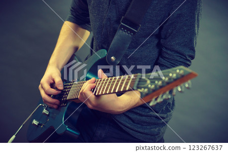 Male hands playing electric guitar Male hands playing electric guitar 123267637