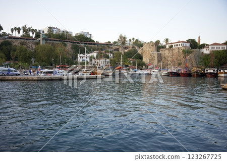 Historic Mediterranean harbor with docked boats. Summer time in Antalya, Turkey Historic Mediterranean harbor with docked boats. Summer time in Antalya, Turkey 123267725