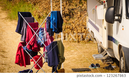 Clothes hanging to dry outdoors by camping car. Caravan vacation. Clothes hanging to dry outdoors by camping car. Caravan vacation. 123267863