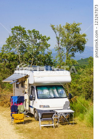 Clothes hanging to dry outdoors by camping car. Caravan vacation. 123267873