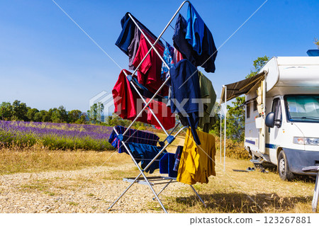 Clothes hanging to dry outdoors by camping car. Caravan vacation. Clothes hanging to dry outdoors by camping car. Caravan vacation. 123267881