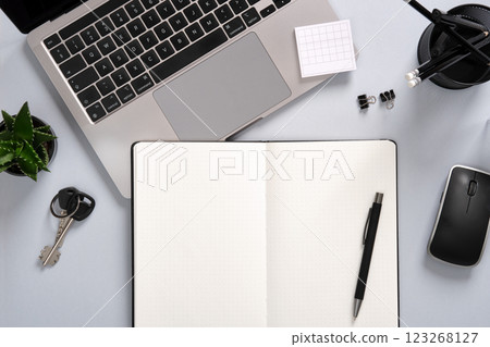 Work desk with computer, notepad, writing supplies. Office table in black and white colors. A place for your text. Work desk with computer, notepad, writing supplies. Office table in black and white colors. A place for your text. 123268127