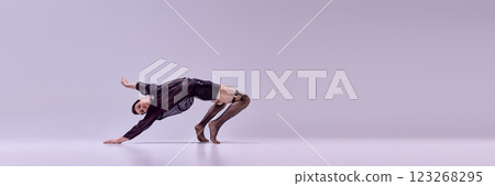 Banner. Performer bending backward with expressive motion against soft gradient background with negative space to insert text. 123268295