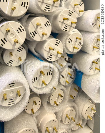 Rows of white filtration cartridges lined up in a storage area Rows of white filtration cartridges lined up in a storage area 123268489