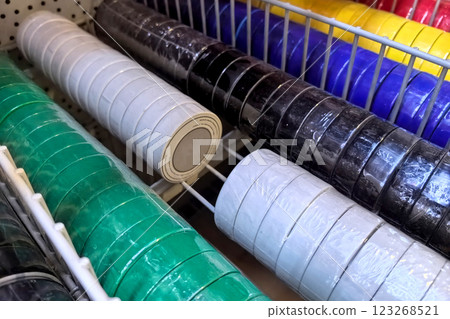 Variety of colorful rolls on display in a crafting supply store aisle Variety of colorful rolls on display in a crafting supply store aisle 123268521