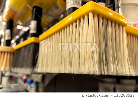 Paint application tools displayed on a shelf in a hardware store Paint application tools displayed on a shelf in a hardware store 123268522