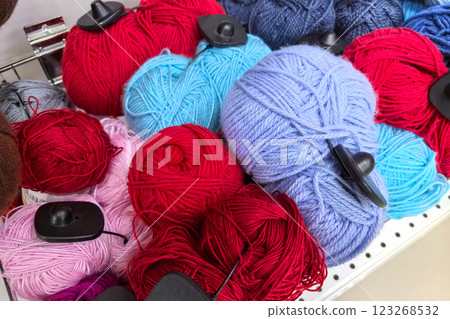 Colorful yarn balls arranged neatly in a crafting store for creative projects 123268532