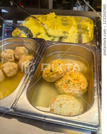 Delicious homemade dumplings and creamy mashed potatoes in a serving tray Delicious homemade dumplings and creamy mashed potatoes in a serving tray 123268560