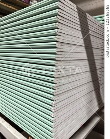 Stacks of green building materials ready for construction at warehouse 123268568