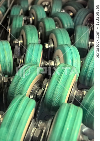 Collection of shiny wheels ready for various transportation tasks in a workshop 123268569